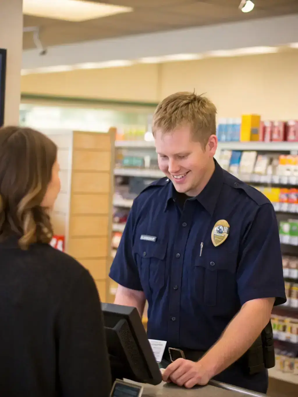 Security guard assisting a customer inside a retail store in Los Angeles.